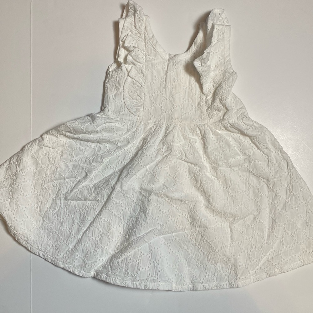 White sleeveless eyelet dress